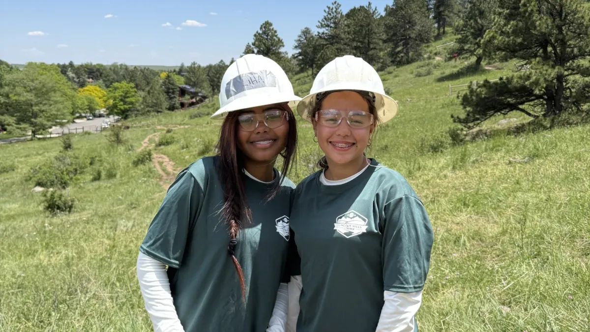 Youth working on a trail project.