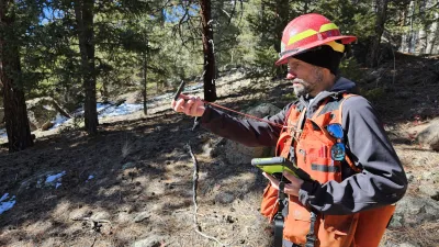 A forestry technician gets to work in a forest